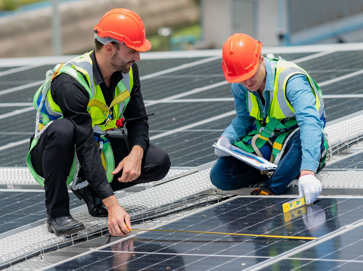 DPM workers Examining Solar Panels